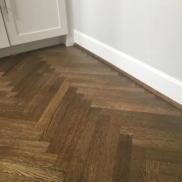 Herringbone floor detail installed by Envision Design Build